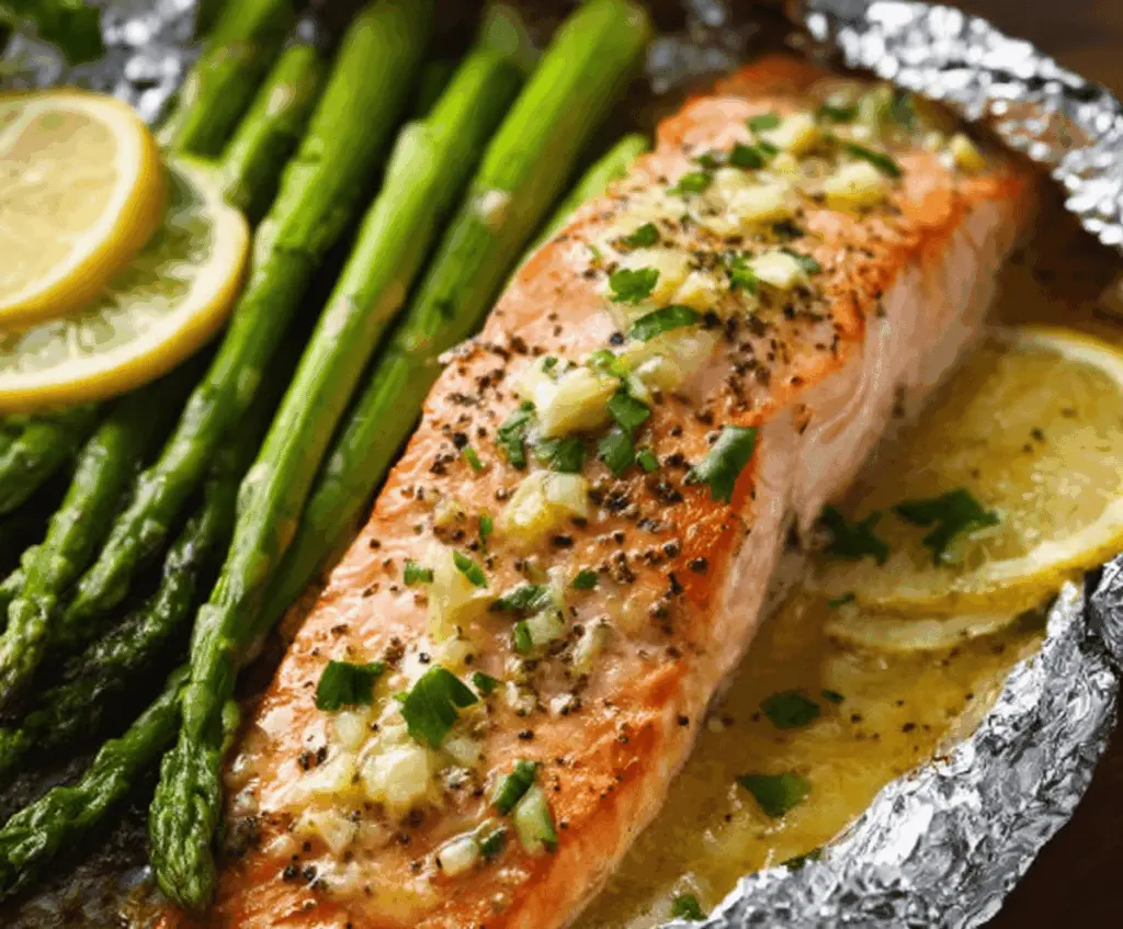 Baked Salmon In Foil With Asparagus And Lemon Garlic Butter Sauce